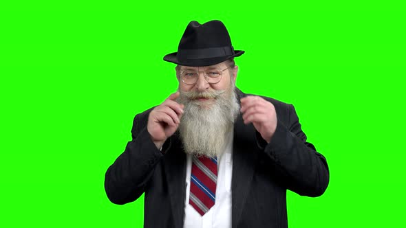 Old Bearded Man Showing Silence Gesture alt