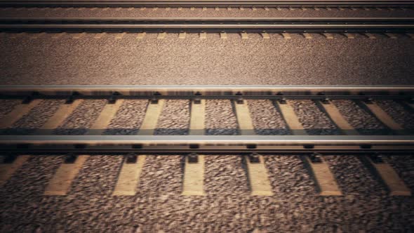 Endless animation of a side view of moving locomoitive on the railroad track. HD alt