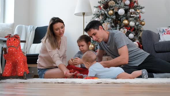 Family of Four Enjoying Christmas Time at Home alt