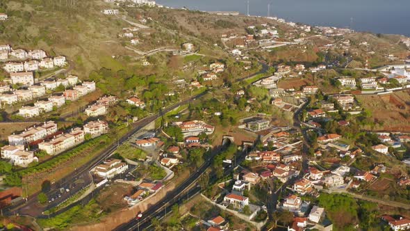 Drone Footage of Beautiful Levadas and Residential Houses Stretching Along alt