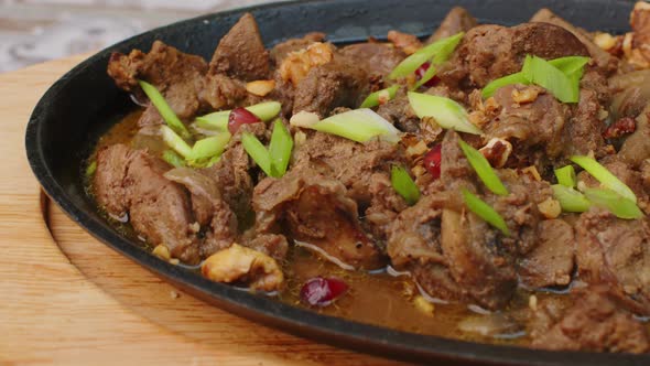 Beef Stew in Frying Pan on Table Close Up View