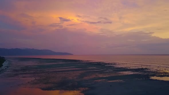 1 million $ aerial view flight boom slider from left to right drone footage of Gili Trawangan beach alt