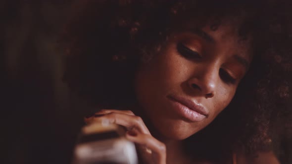 Woman With Afro Hair Using Vintage 8Mm Camera alt
