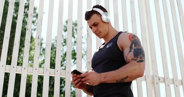 Portrait of Male Athlete Doing Exercises Outdoors in Summer alt