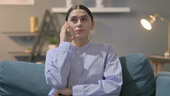 Portrait of Pensive Hispanic Woman Thinking alt