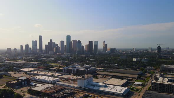 Rotating around industrial park with Houston skyline, Stock Footage