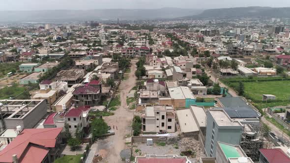 Aerial view of homes in Mekelle, Ethiopia. This video was filmed in 4k for best image quality. alt