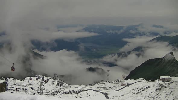 View from the Kitzeinhorn with rising clouds. alt