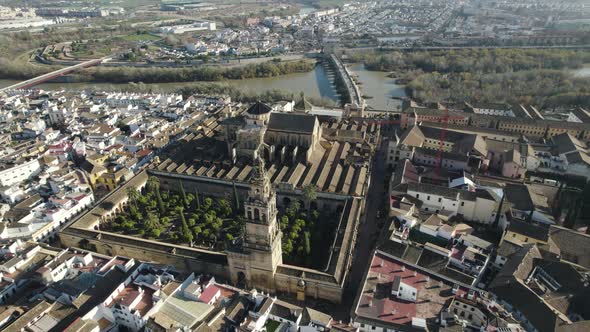 Aerial  backwards view over magnificent city of Cordoba, with its cathedral-mosque