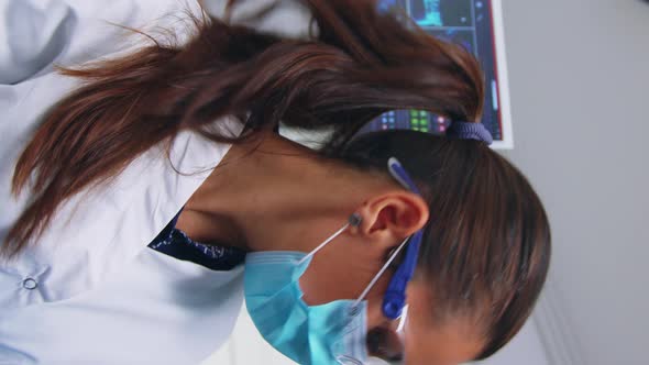 Vertical Video Patient Pov to Doctor in Stomatological Office Treating Teeth alt