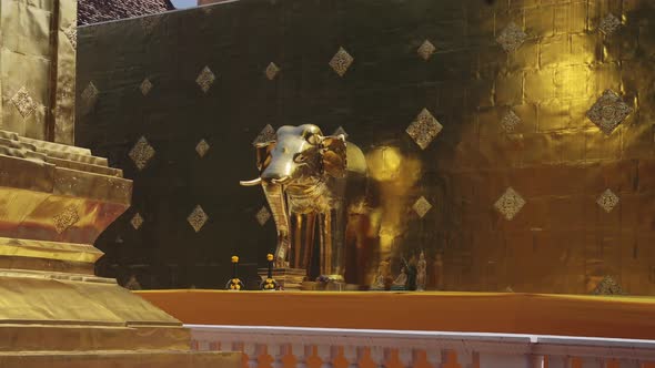 Gold Leaf Elephant Statue at a Buddhist Temple in Chiang Mai, Thailand, at Wat Phra Singh, a Beautif alt