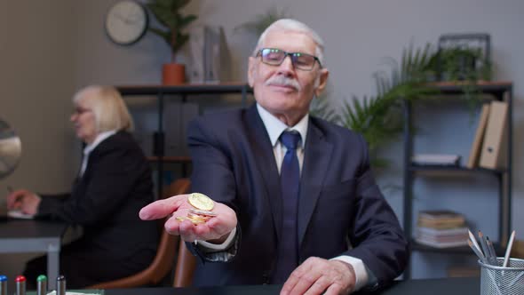 Positive Smiling Businessman Showing Crypto Currency Bitcoins Income From Stock Market or Mining alt