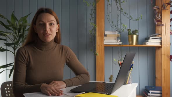 Woman Look at Camera and Wave Hand Greets Friend Start Conversation By Video Conference alt