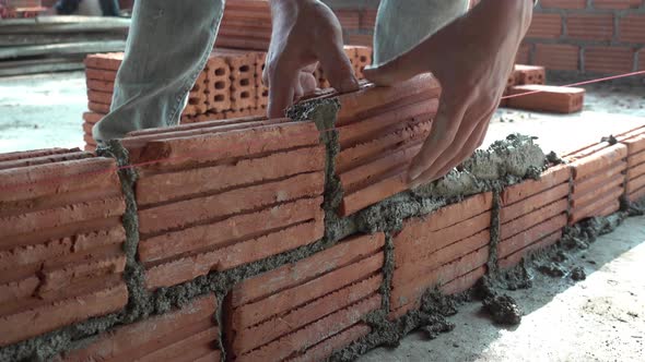 Worker building masonry house wall