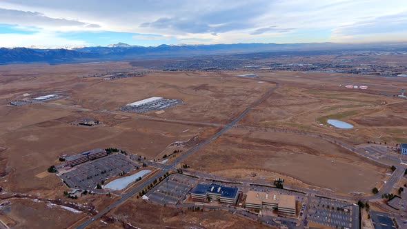 View of Rocky Mountain Metropolitan Airport from an airplane flying the downwind leg with Longs Peak alt