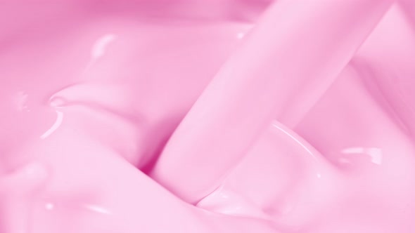Super Slow Motion Shot of Pouring and Splashing Strawberry Milk at 1000Fps. alt
