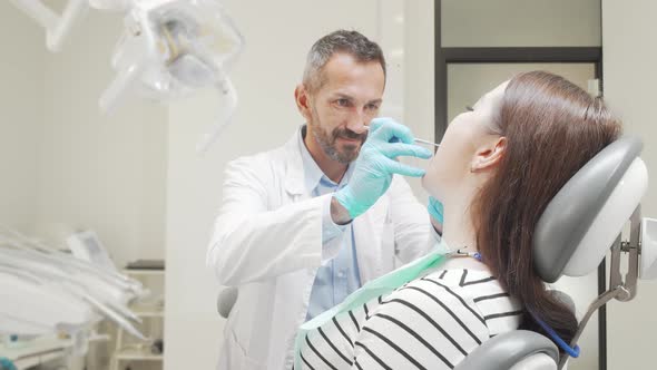 Cheerful Young Woman Smiling To the Camera After Dental Checkup