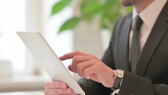 Close Up of Hands of Middle Aged Businessman Reacting to Failure on Tablet alt