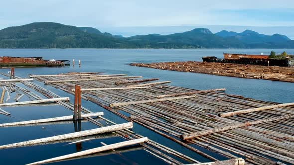 Log booms with mountains in background alt