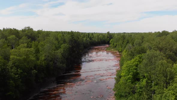  Shallow River With Red Rocks In The Woods