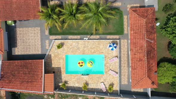 Float smile emoji emoticon icon buoy at swimming pool at countryside alt