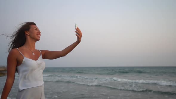 Woman on Beach Summer Holidays Having Video Call on Smartphone
