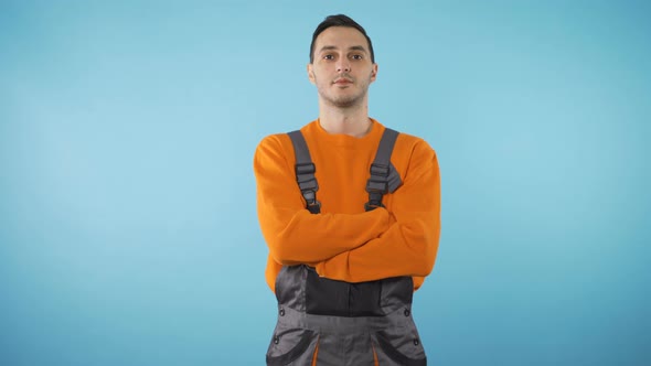 Young Repairman Look in To Camera Studio Shot  alt