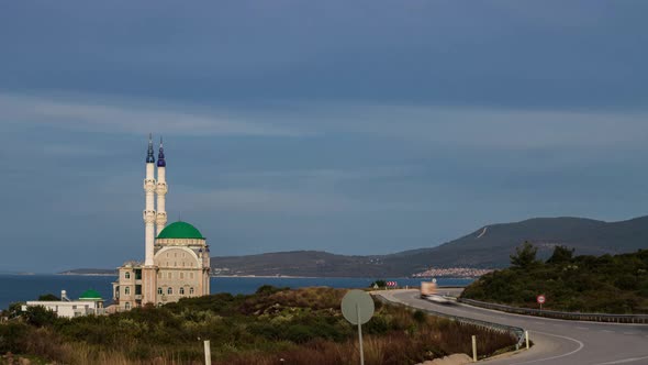Traffic Timelapse Mosque and Minarets Near the Road and Sea in the Turkish City Izmir alt
