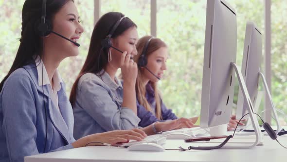 Customer Support Agent or Call Center with Headset Talking to Customer on Phone alt