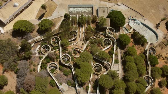 Old And Abandoned Water Park "Aqualine" In Altura, Algarve, Portugal. - aerial descend alt