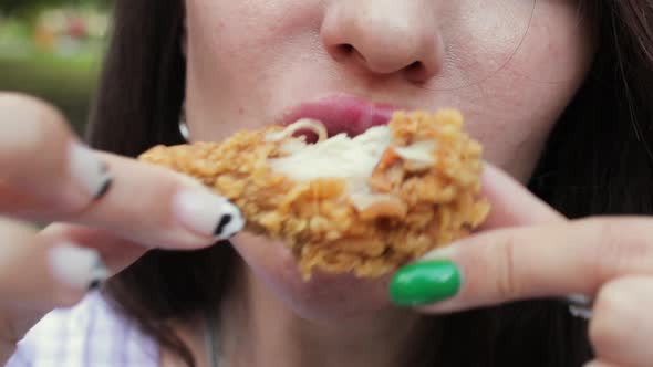 Woman Eating A Chicken Wing CloseUp Fast Food