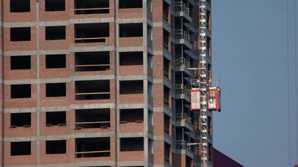 Building Under Construction with an Elevator Lift alt