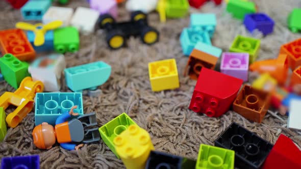Multicolored Plastic Building Blocks Scattered on the Floor alt
