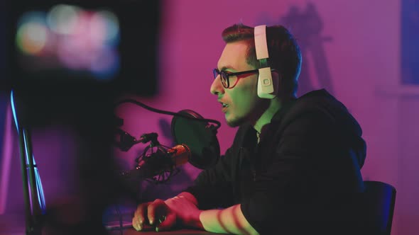 Man in Headphones Talking on Podcast alt