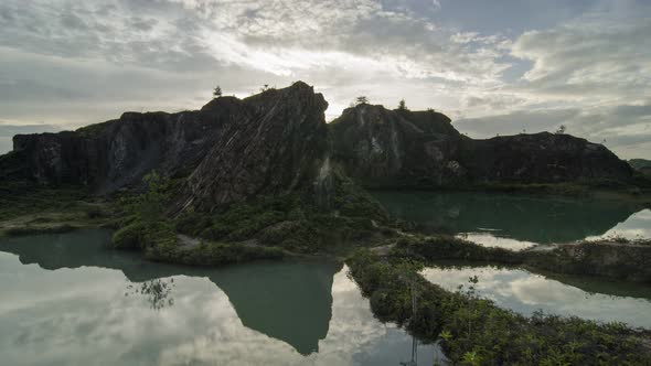Timelapse Road path towards the little hill of reflection sunset rocky mountain. alt