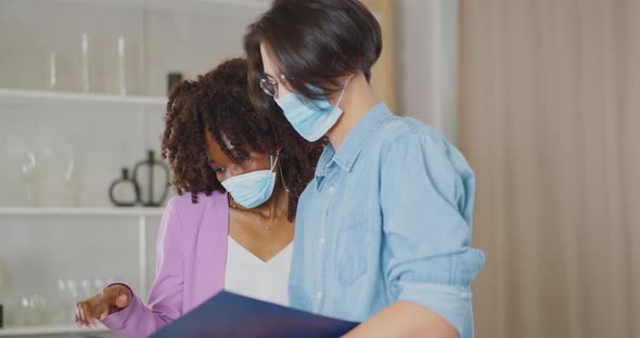 Business partners are reviewing graphs Work of business partners Home office Coffee at work Covid-19 alt