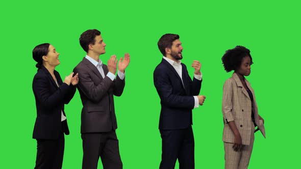 Young Office People Hearing Some Pleasant News and Start Clapping on a Green Screen Chroma Key alt