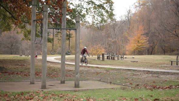 Exercise Course and Bike Path with bicyclist - Rock Creek Park - Washington, DC - Autumn alt