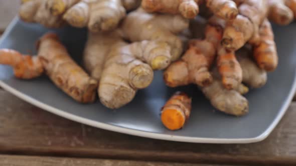 Natural Immunity Boosters  Roots of Ginger and Turmeric on Plate Alternative Medicine alt