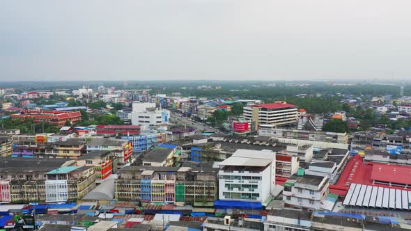 Aerial view of Rom Hoop market. Thai Railway with a local train run through Mae Klong Market alt