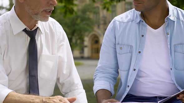 Mentor Sharing Life Experience With Student, Teaching Student Through Discussion alt