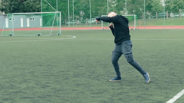 Young Bearded Guy Practising Boxing Exercises Outdoors alt