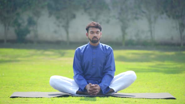 Indian man doing Butterfly Yoga Pose or Badhakonasana in an Indian ...