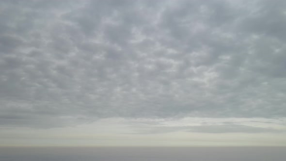  Panorama of the sky with dense gray clouds at sunset