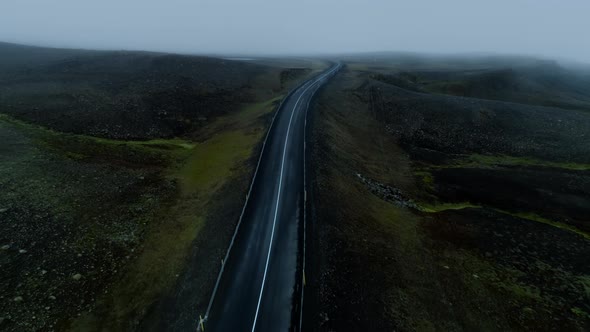 Moody Epic Foggy Road in Mountain in Iceland