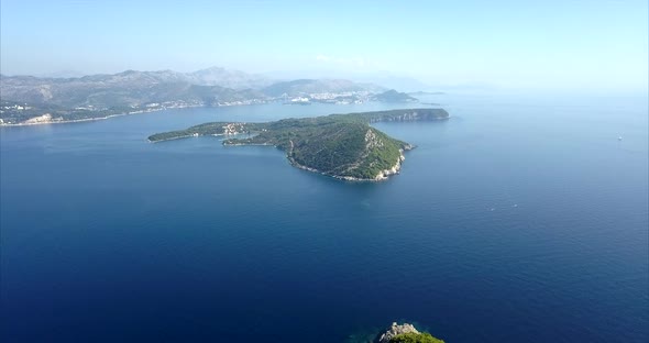 Kolocep Island in Croatia, aerial footage with slow push in. Beautiful blue sea and blue skies alt