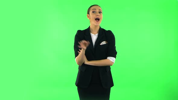 Smiling Girl Winks and Makes Sign Ok, Then Thumbs Up Gesture Like. Green Screen alt