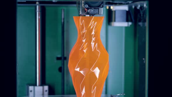 Orange Vase Is Getting Finished By a 3D-printer alt