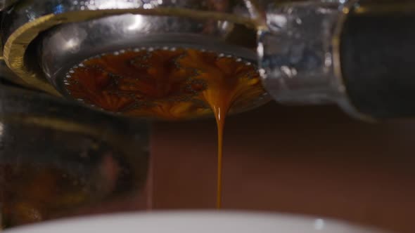 Pouring Coffee Stream From Professional Machine in Cup. Flowing Fresh Ground Coffee. Drinking alt