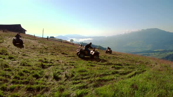 People Riding on Quad Bikes in Carpathian Mountains alt
